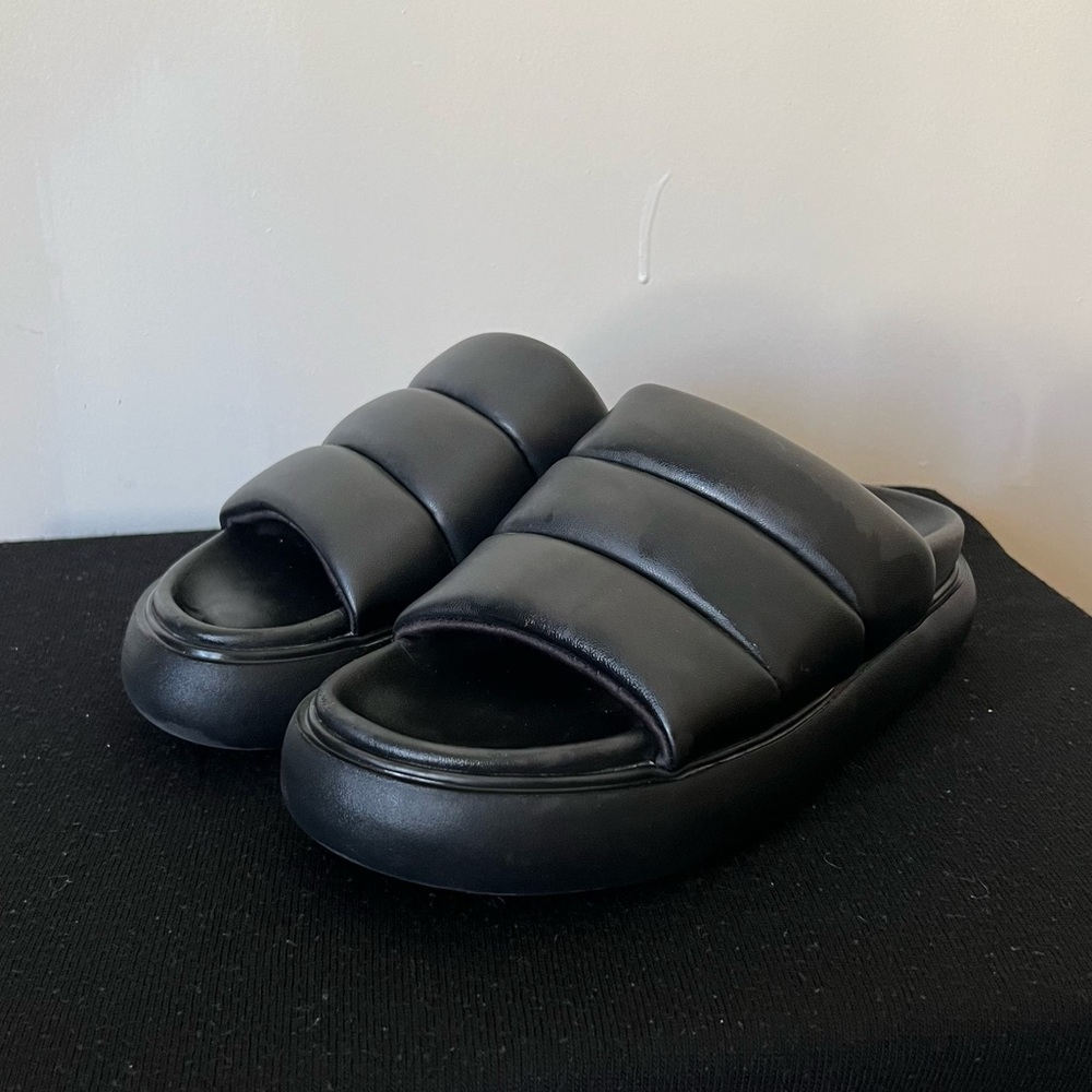 Black platform slides.